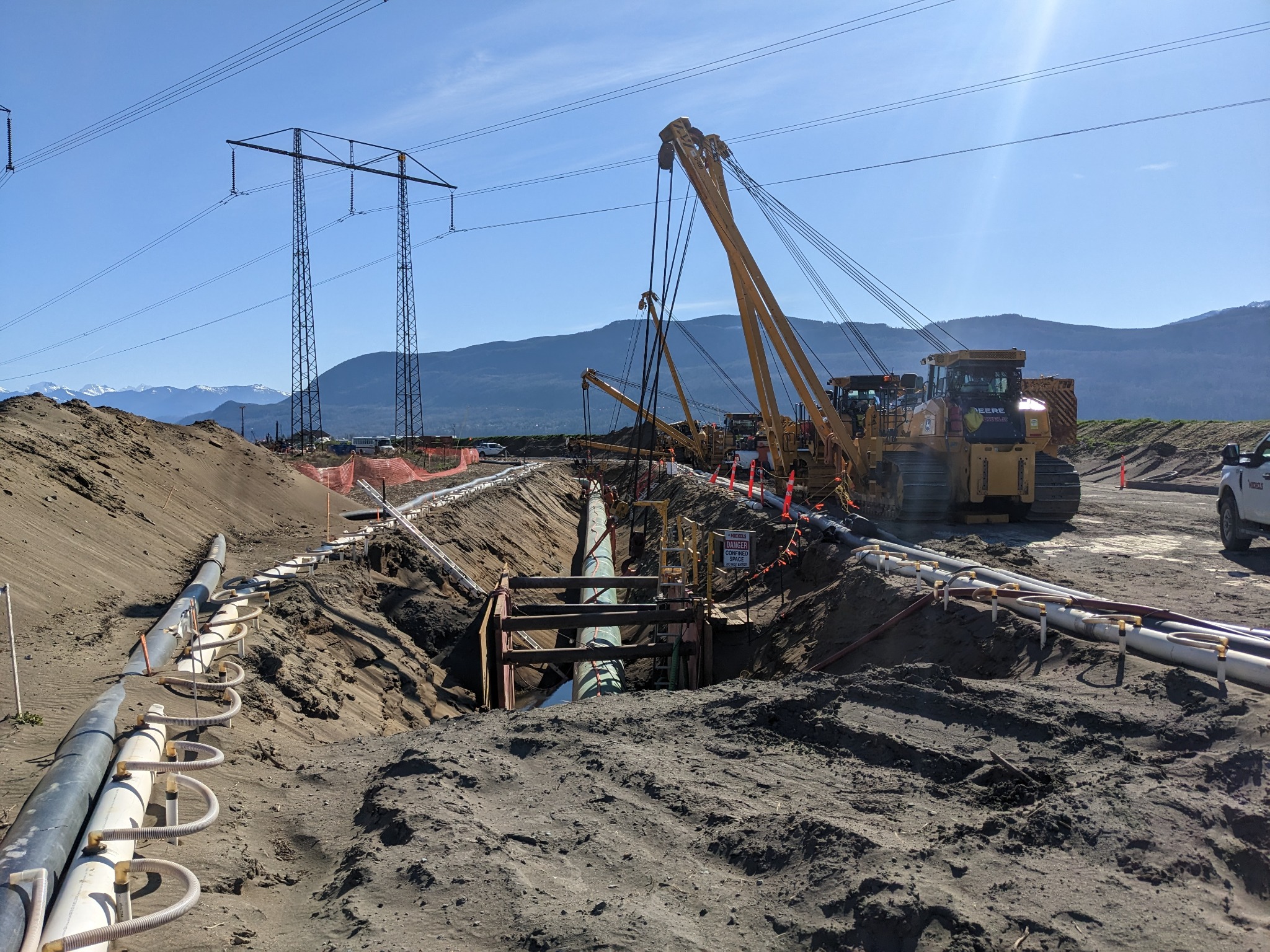 Pipeline construction fleet using machine-control systems
